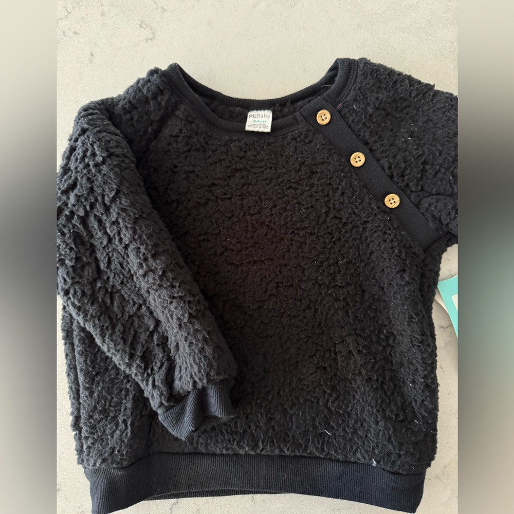 NWT Sherpa black long sleeve sweatshirt, size 24 months